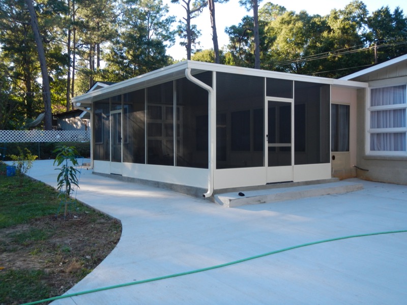 Screened in patio cover with entryway and white trim