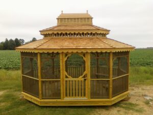 Screened in oval-shaped gazebo with a coupla
