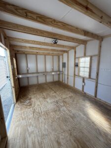 10X16 Workshop with Colonial White siding and Black trim and a Standard roof